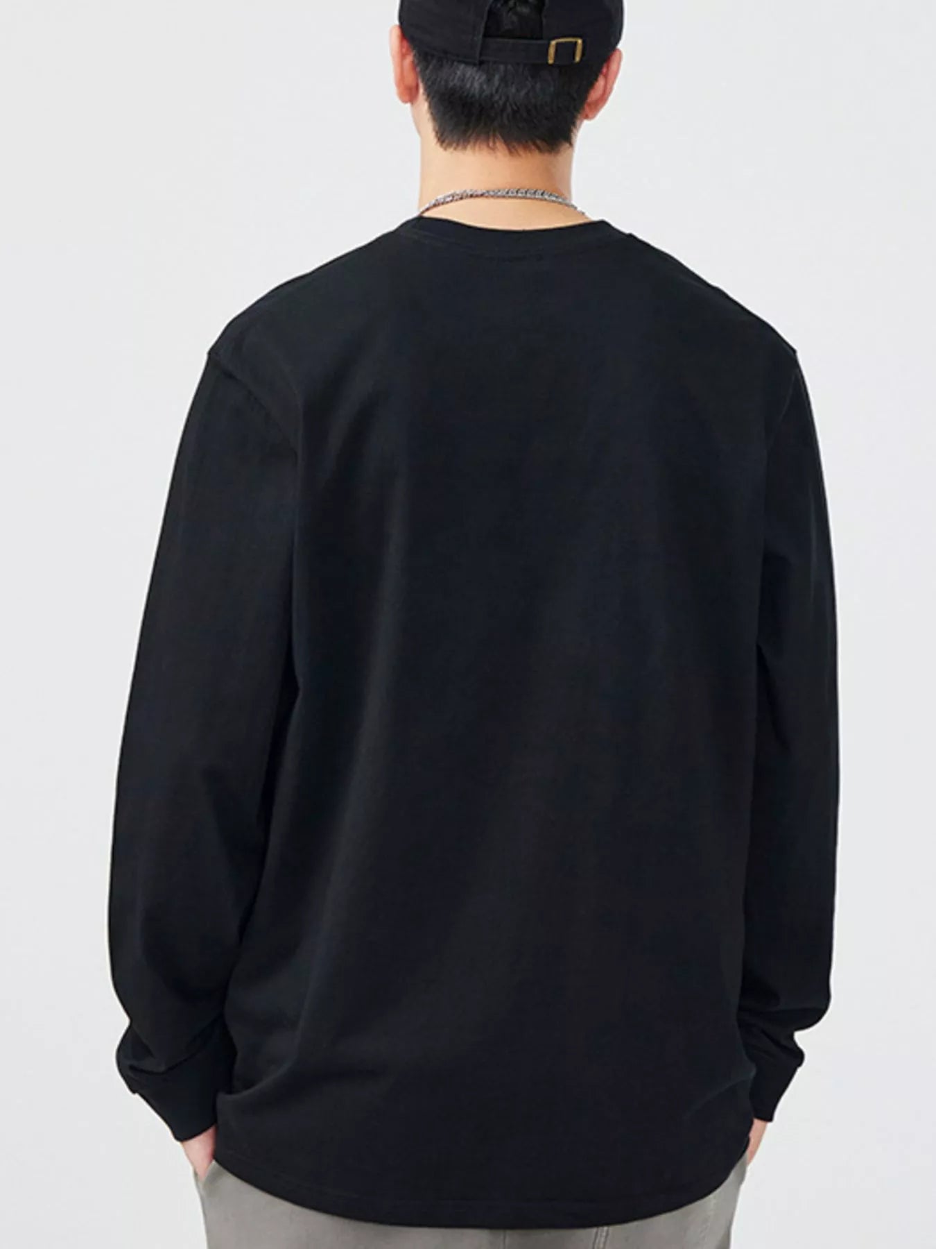 Black long-sleeve T-shirt with round neck, back view