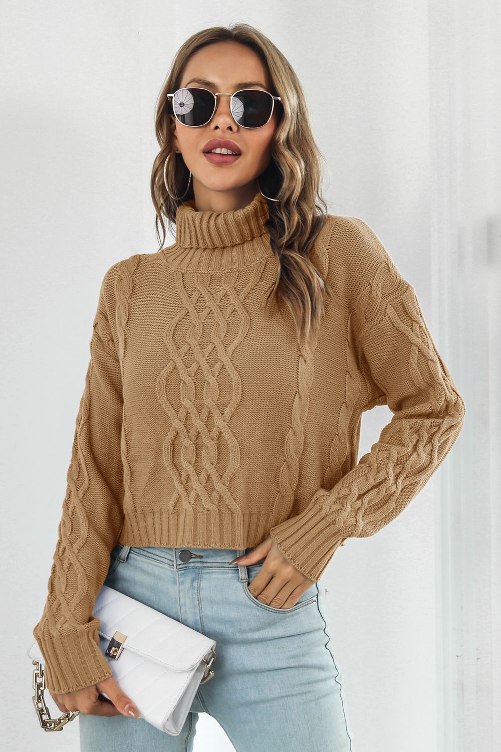 Camel cable-knit turtleneck sweater with dropped shoulders and textured knit