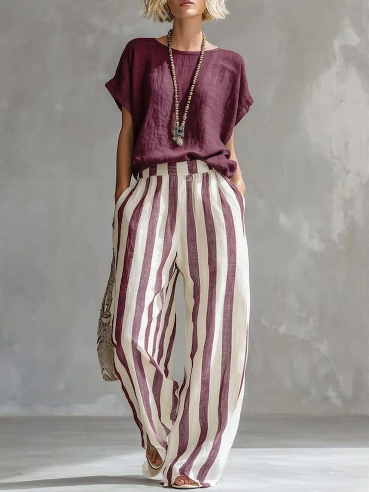 Wine red short-sleeve top with wide-leg pants in vertical white-and-wine stripes