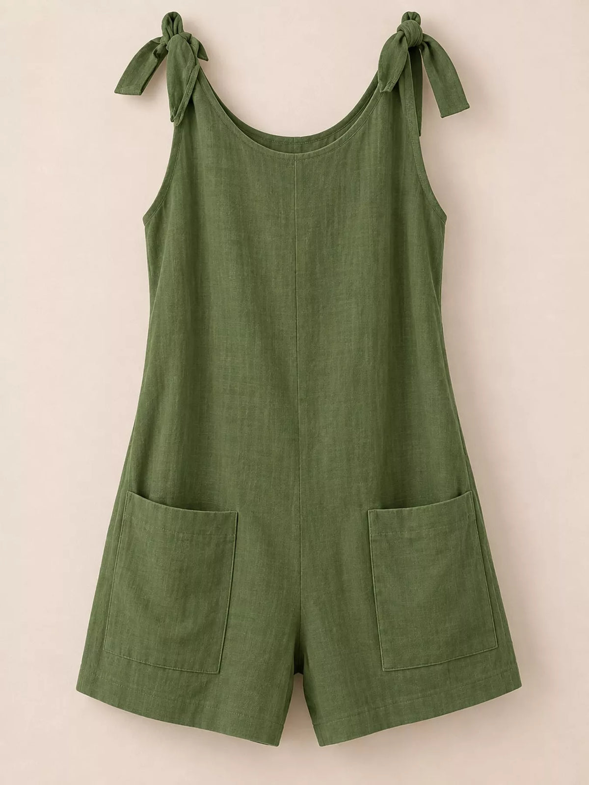 Green tie-shoulder bow romper with front pockets and loose shorts, scoop back design