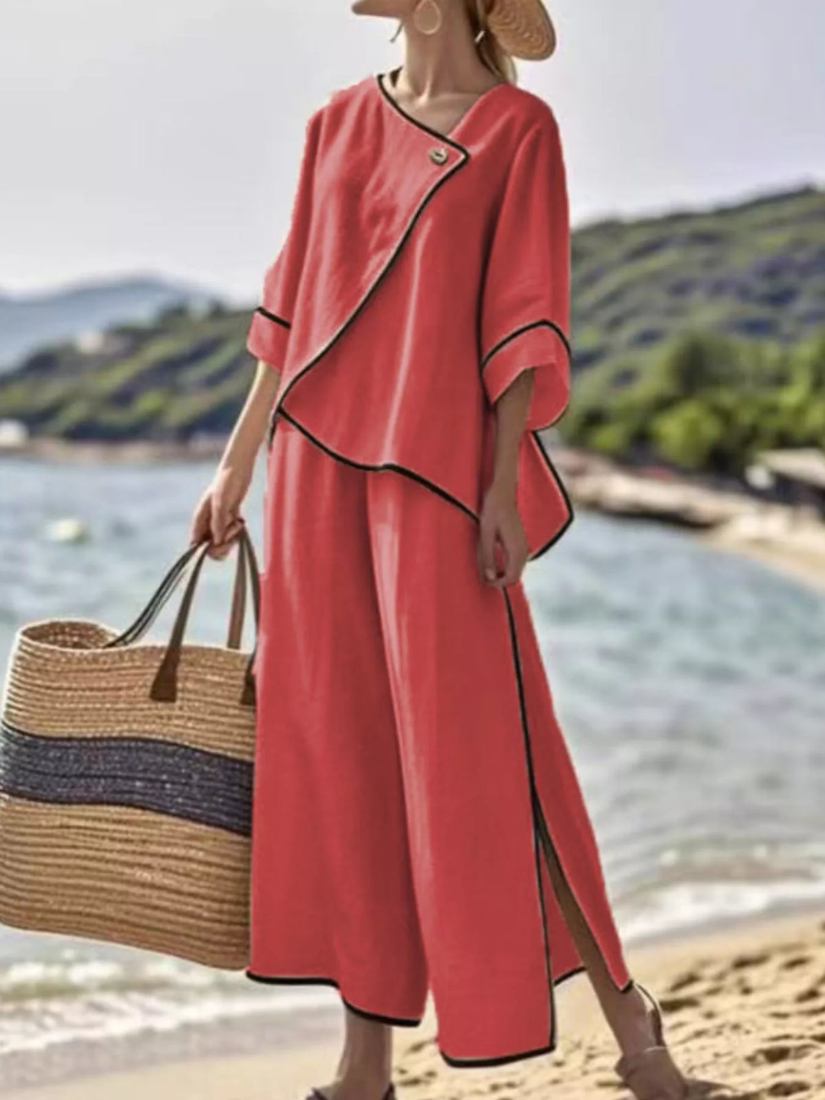 Red two-piece pants set with black contrast trim, V-neck wrap front, wide-leg pants