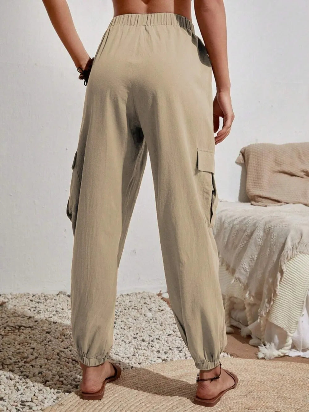 Light khaki drawstring cargo joggers with cargo pockets and elastic cuffs
