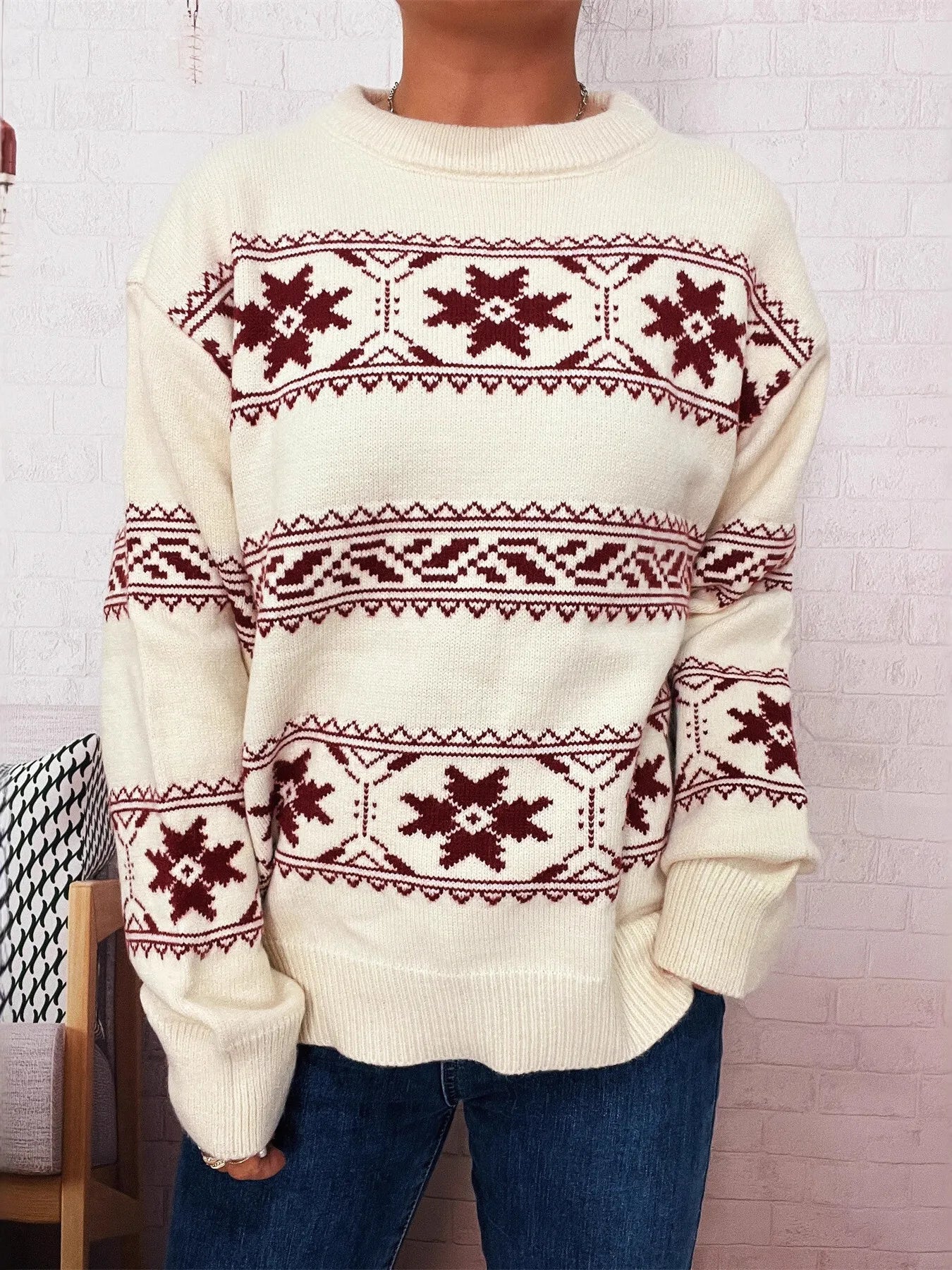 White knit sweater with red snowflake Fair Isle design and ribbed cuffs and hem