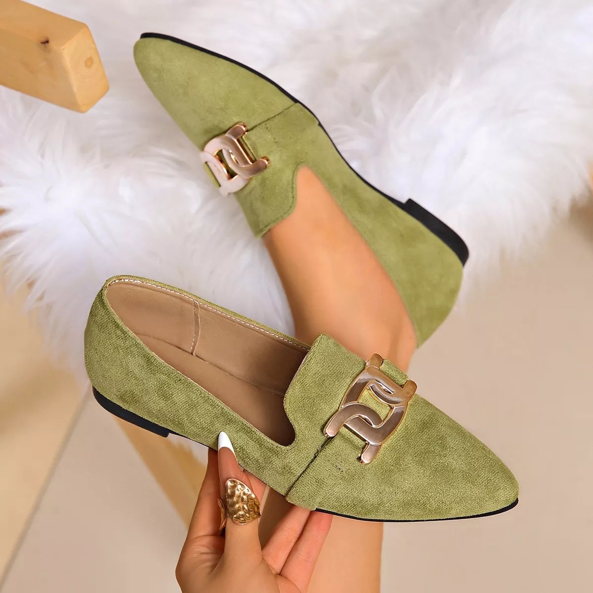 Matcha green suede pointed loafers with gold chain link buckle and low heel