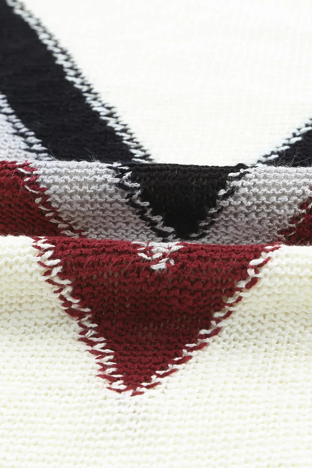 Chevron V neckline knit close-up with black stripe over cream and burgundy bands