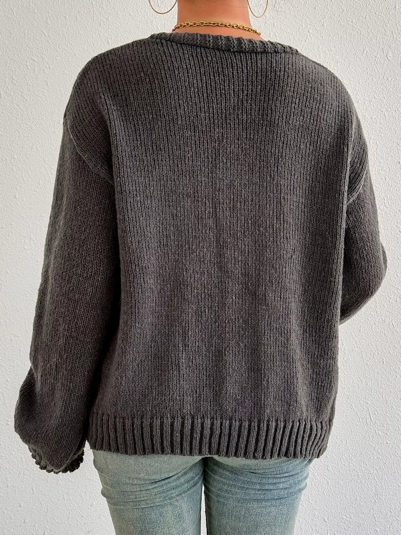 Dark gray knit cardigan back view with ribbed crew neckline and long sleeves