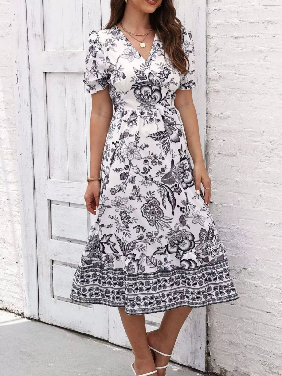 Floral print midi dress with puff sleeves and V-neck, black floral on white with border