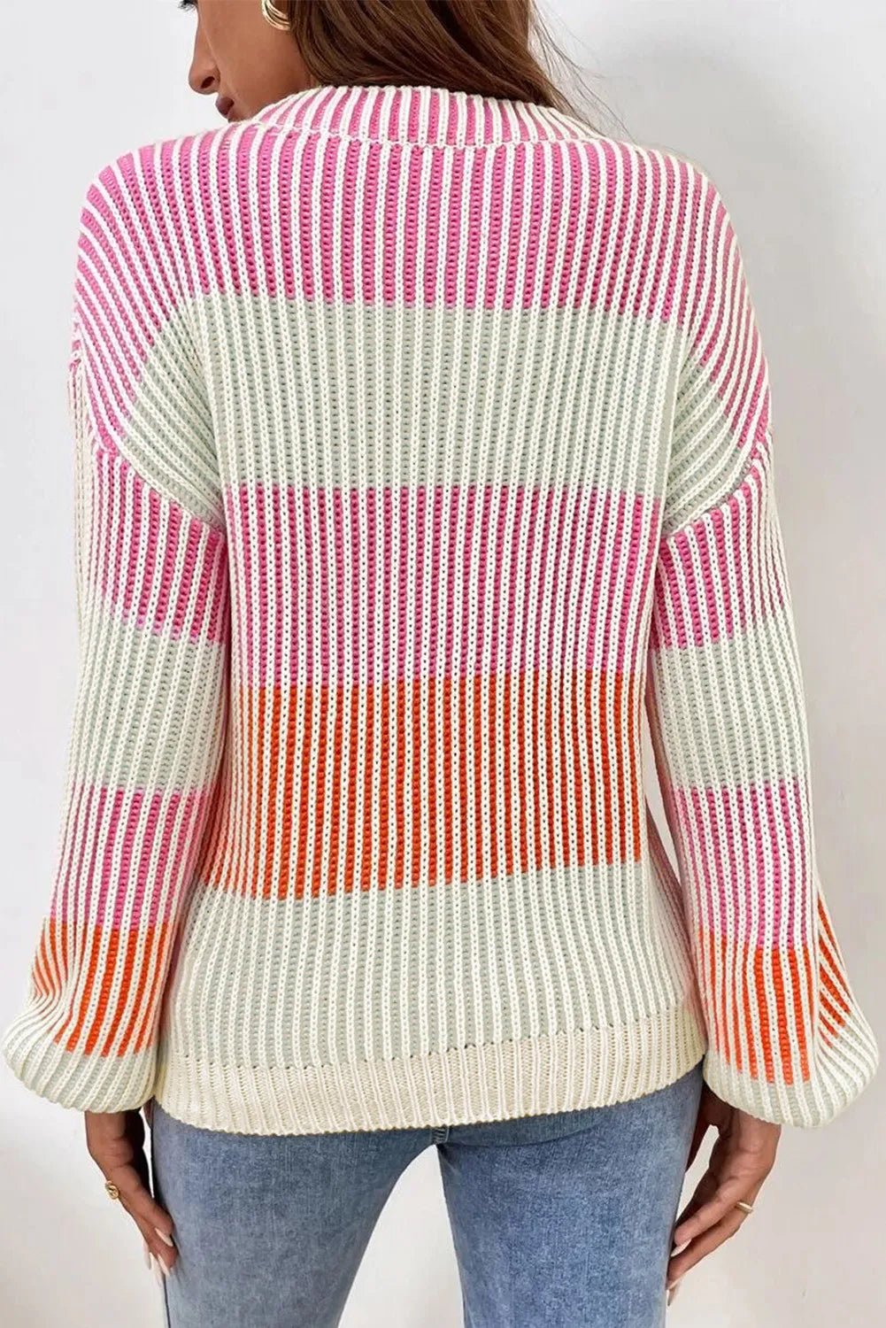 Back view color-block striped long-sleeve sweater in dusty pink, cream, mint, and orange