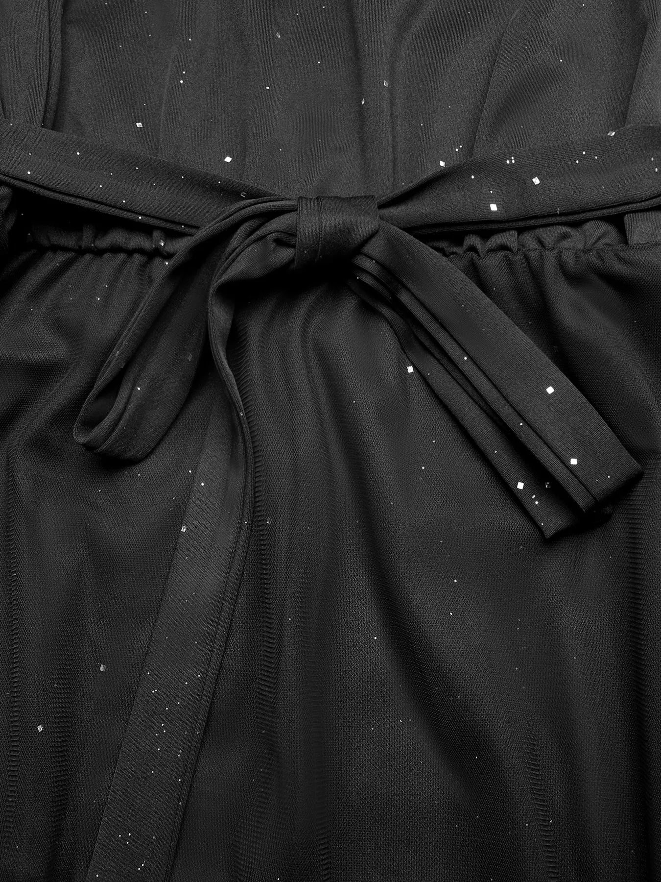 Cedar & Moore Glitter Sleeveless Tulle Midi Dress in black with tied waist.