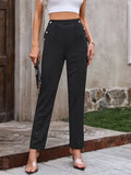 Black elastic-waist pants with decorative buttons at waistband, straight leg fit