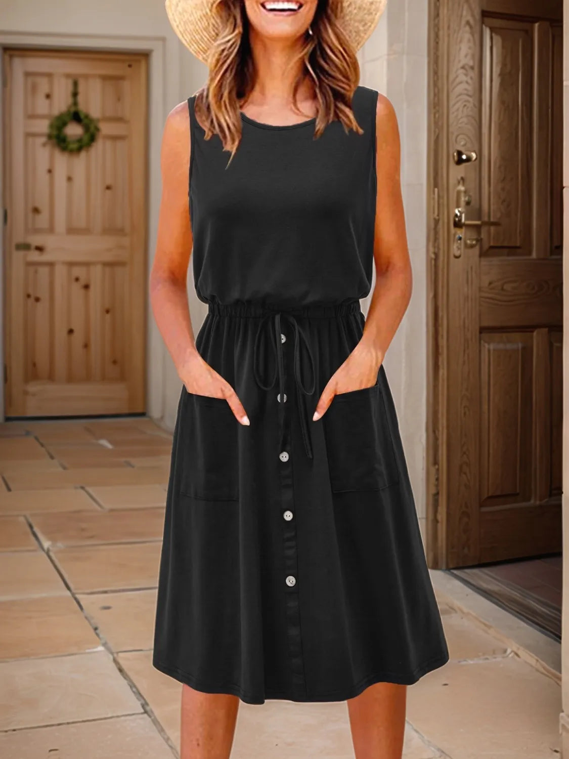 Plus-size black round-neck sleeveless tank dress by Trendsi with a drawstring waist and button-front dress