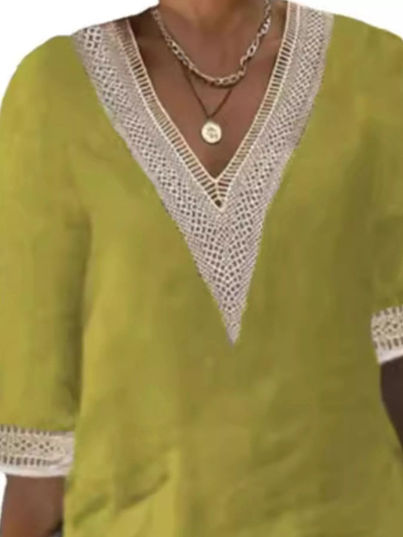 Yellow-green V-neck lace-trim dress detail with crocheted lace neckline and cuffs