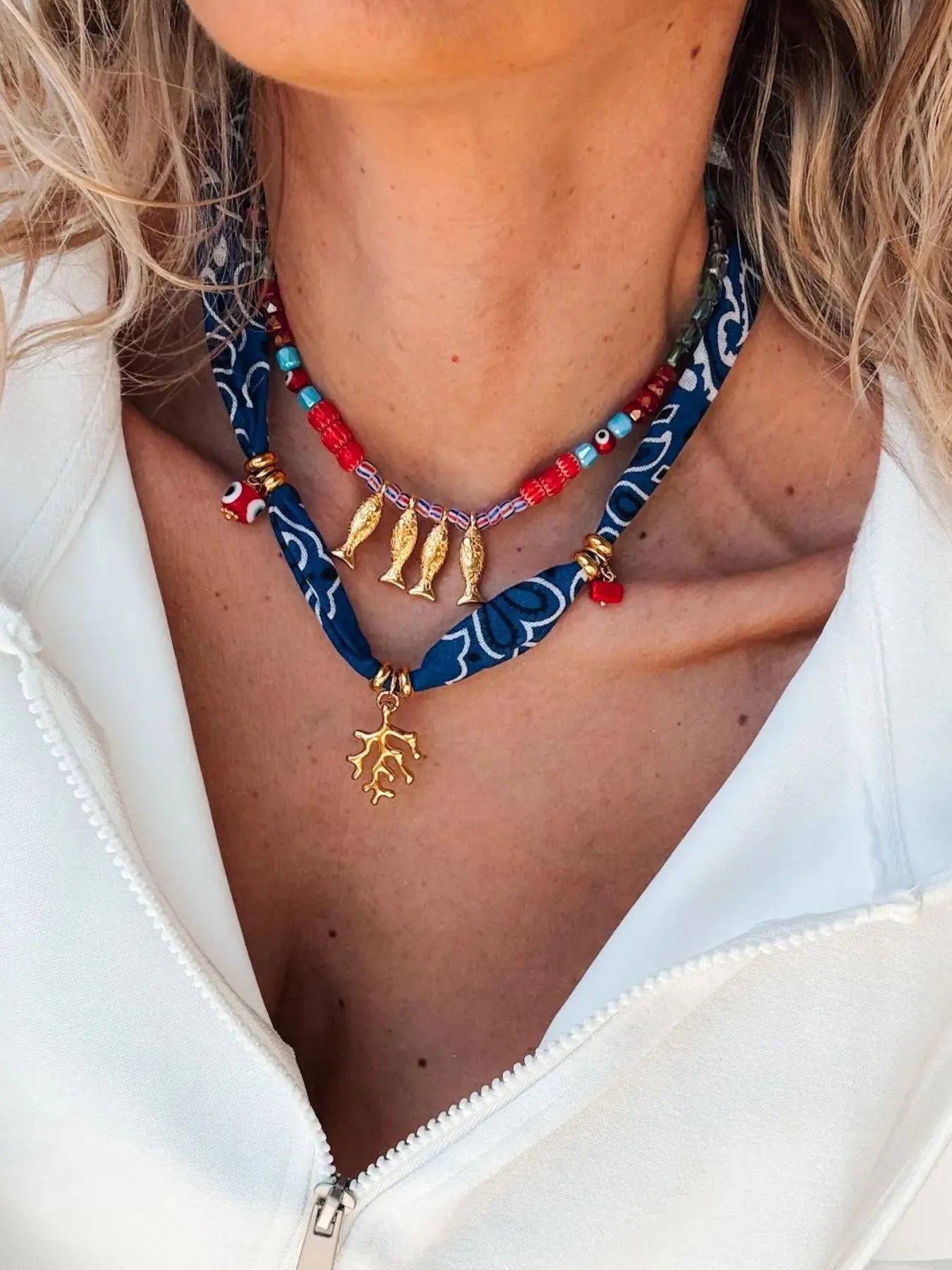 2-piece necklace with gold fish pendant and multi-color bead accents