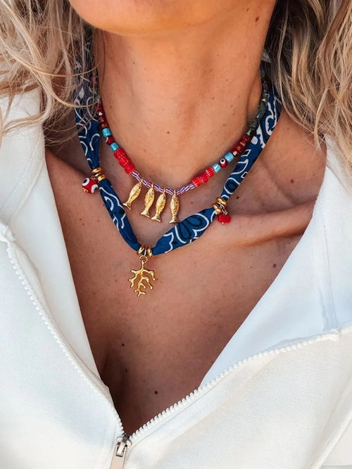 2-piece necklace with gold fish pendant and multi-color bead accents