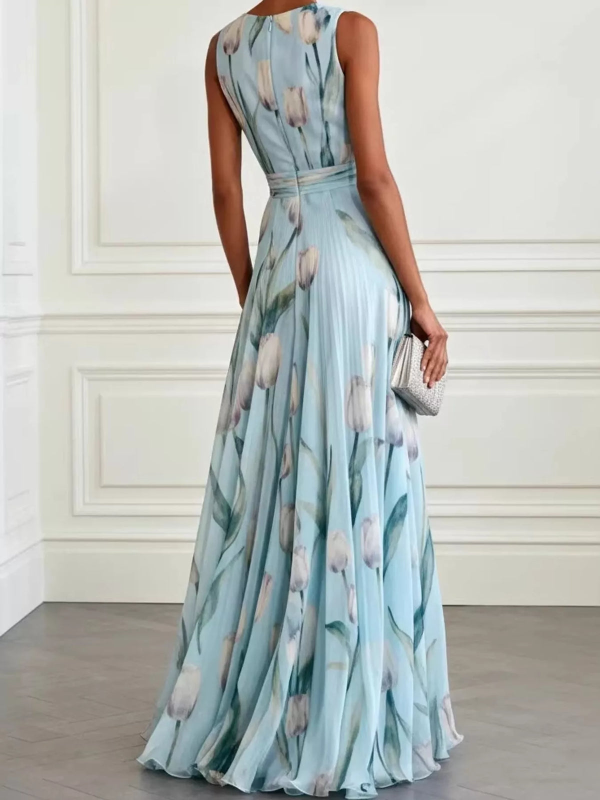 Sky blue sleeveless floral maxi dress with ruched bodice and flowing skirt
