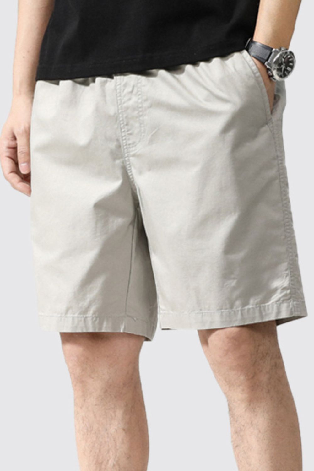 Light gray casual shorts with side pockets and button-front closure
