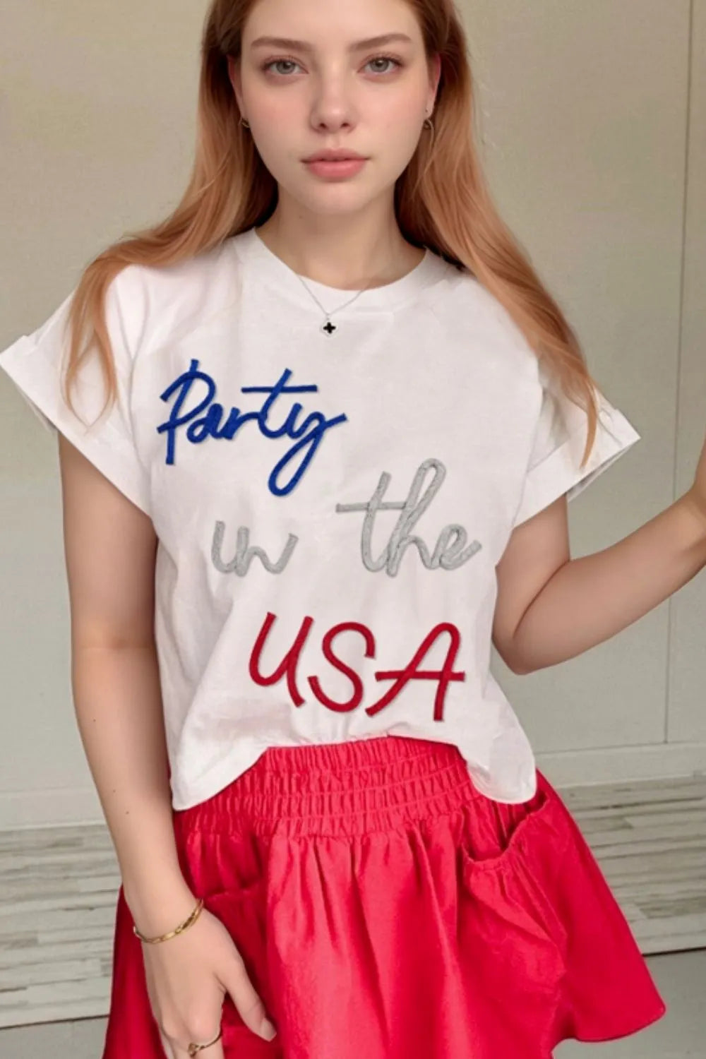 White round-neck short-sleeve T-shirt with 'Party in the USA' lettering