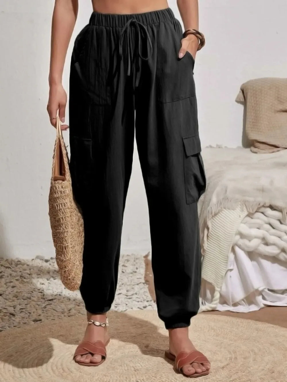Black drawstring cargo joggers with side cargo pocket and cuffed ankles
