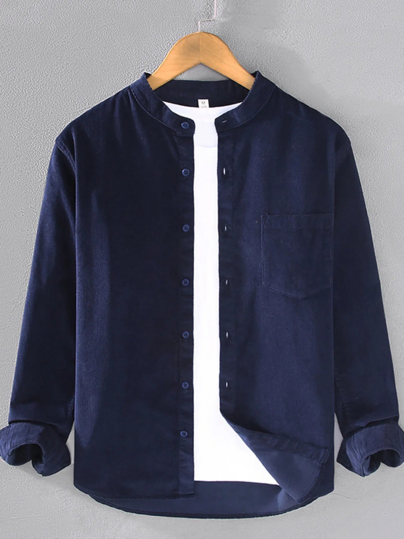 Men's long-sleeve button-up shirt in dark blue, with front buttons and chest pocket