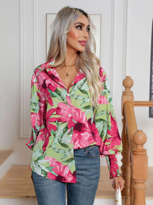 Floral button-down long sleeve shirt in hot pink and green with visible front buttons