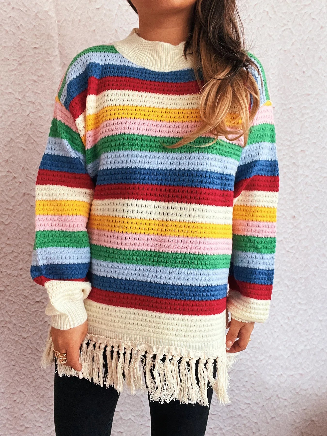 Rainbow striped long sleeve sweater with cream collar and tassel fringe hem