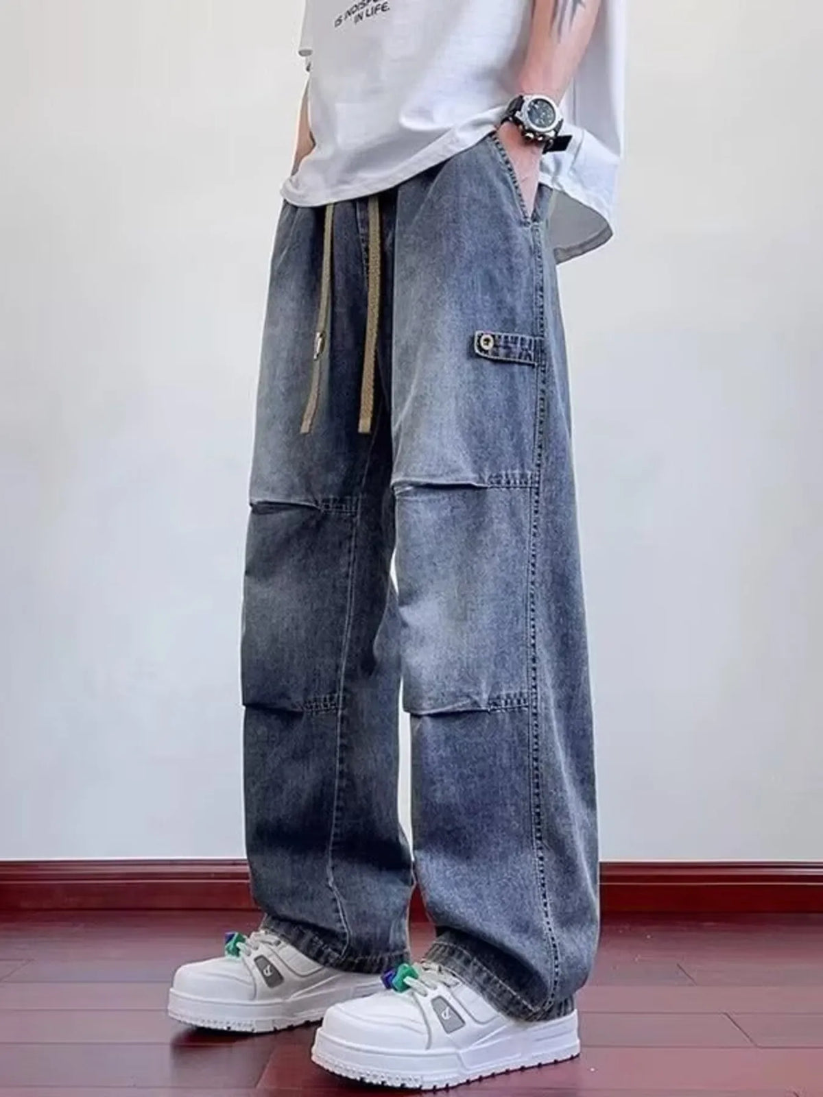 Men's wide-leg washed denim pants with patch pockets and drawstring tie, dark blue