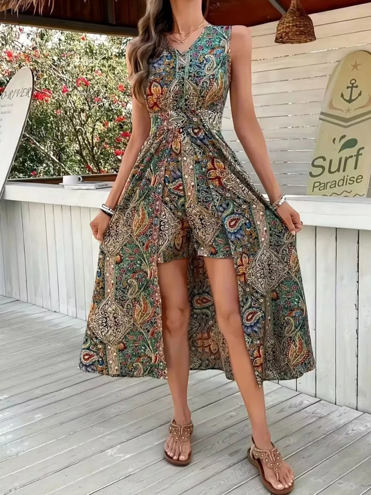 Sleeveless paisley print romper, green-blue base with ornate accents, gathered waist