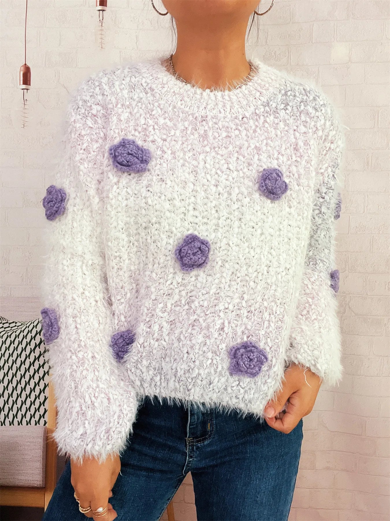 Flower-embellished round-neck sweater, fuzzy white knit with scattered purple rosettes