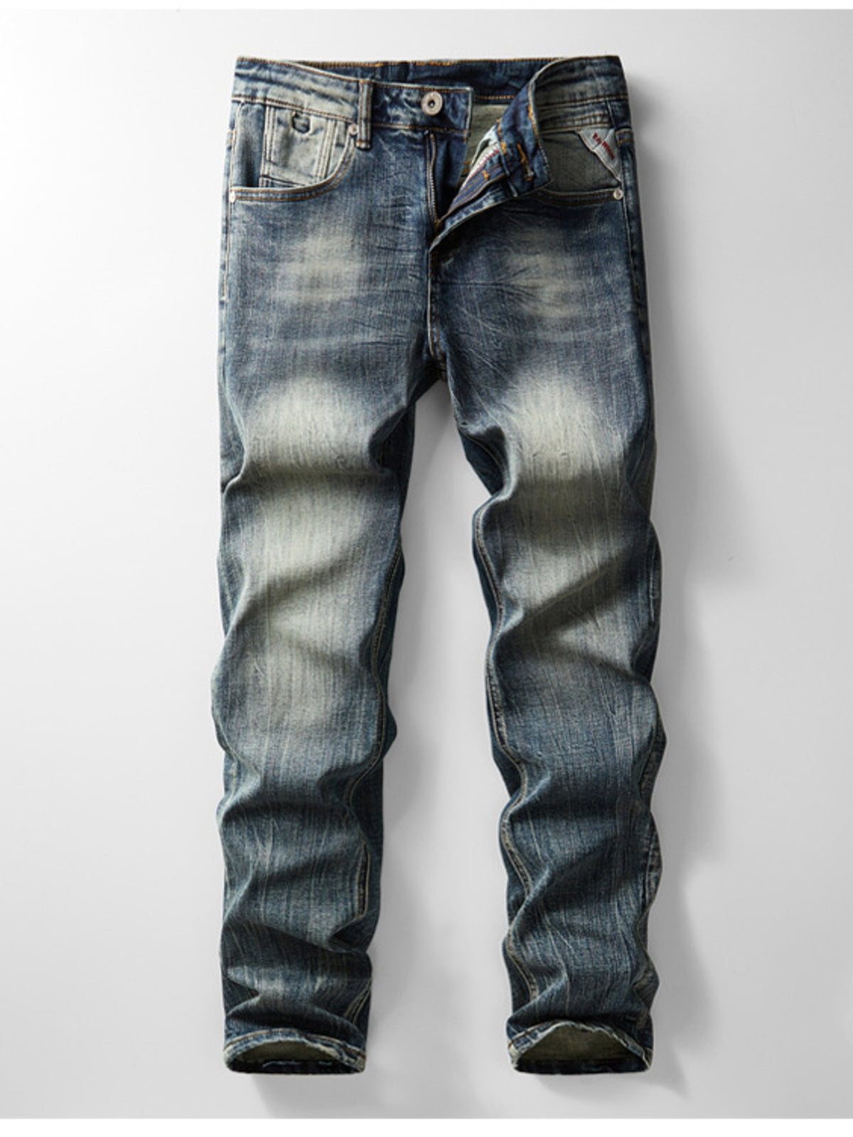 Men's slim-fit vintage wash cotton denim jeans, button fly, whisker seams, dual pockets