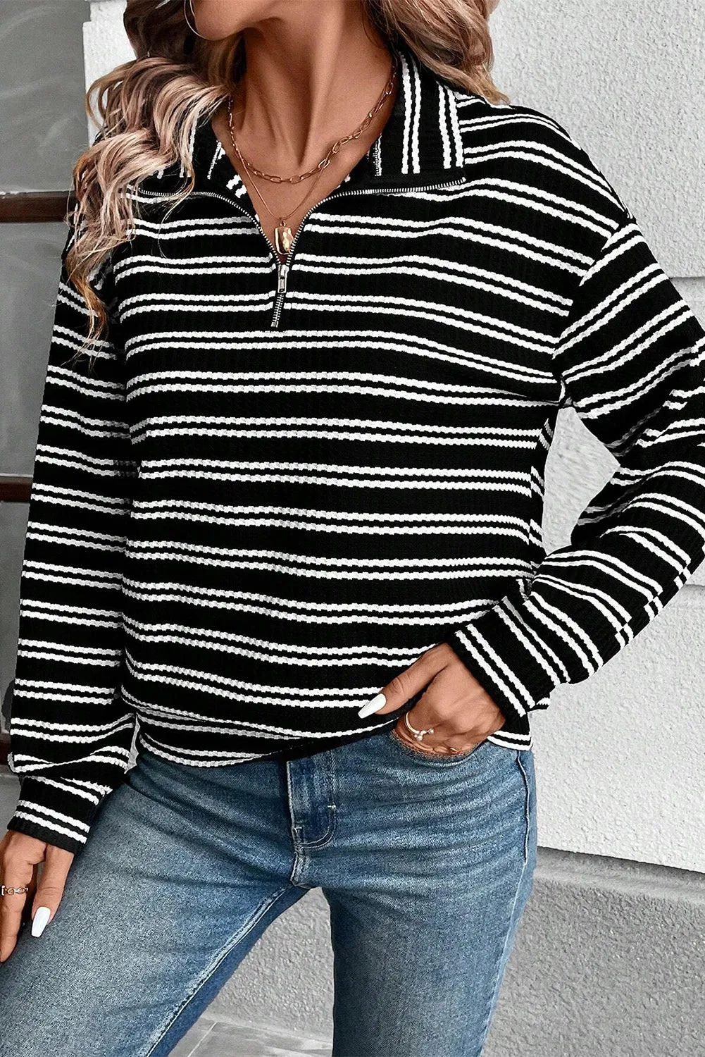 Black-and-white striped half-zip long sleeve top with stand collar