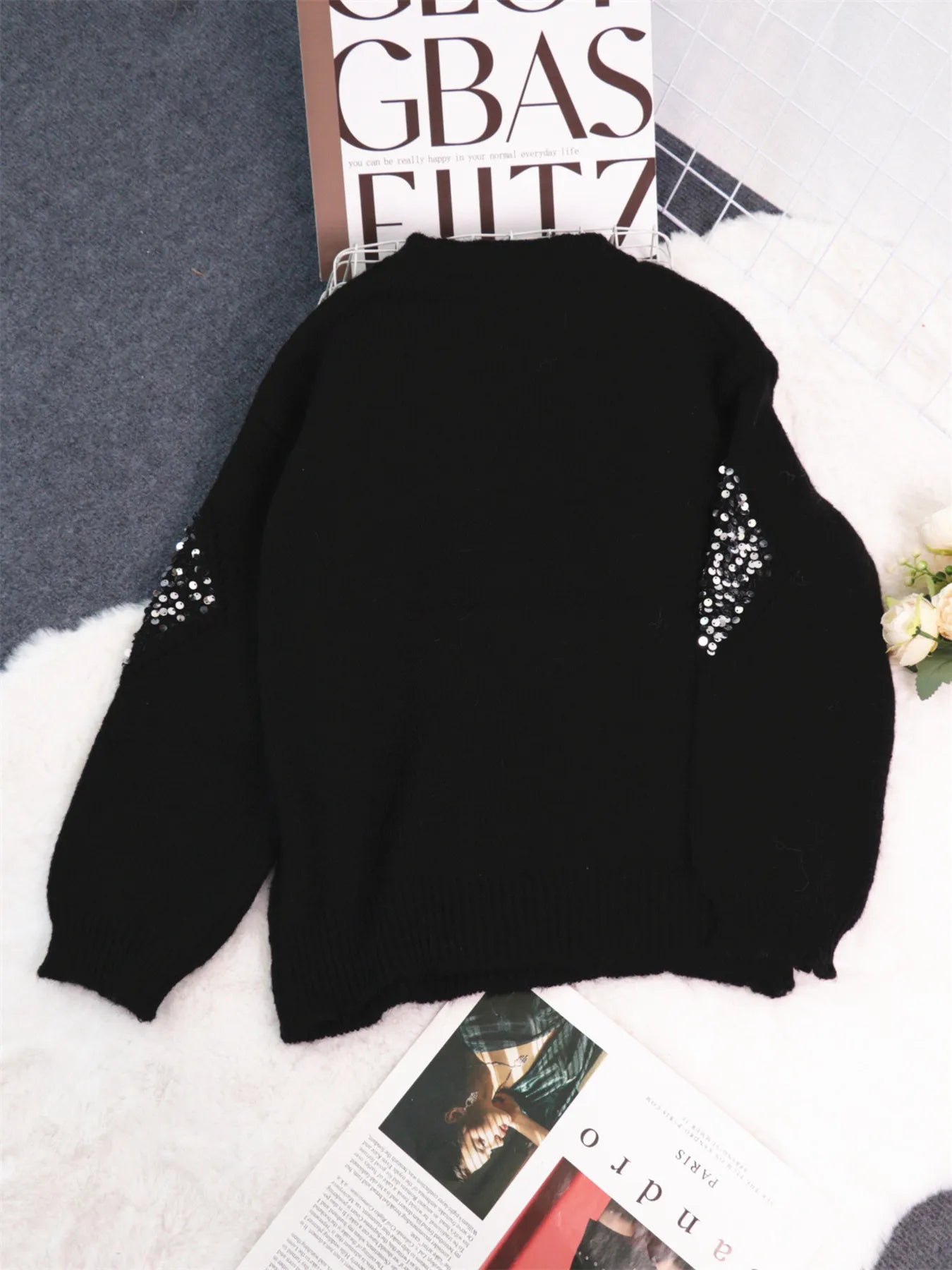 Black oversized sweater with sequin diamond detail at the shoulders