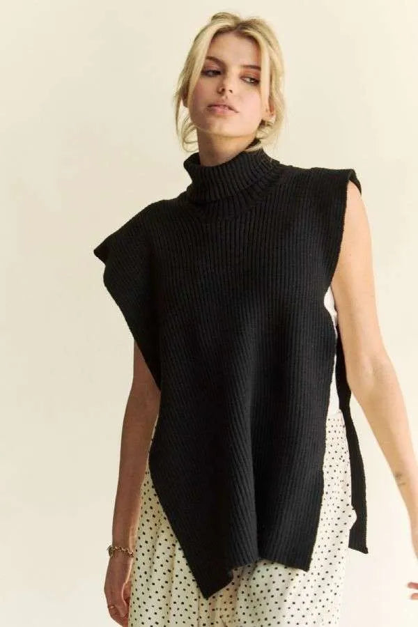 Black sleeveless turtleneck knit top with side slit and asymmetrical drape