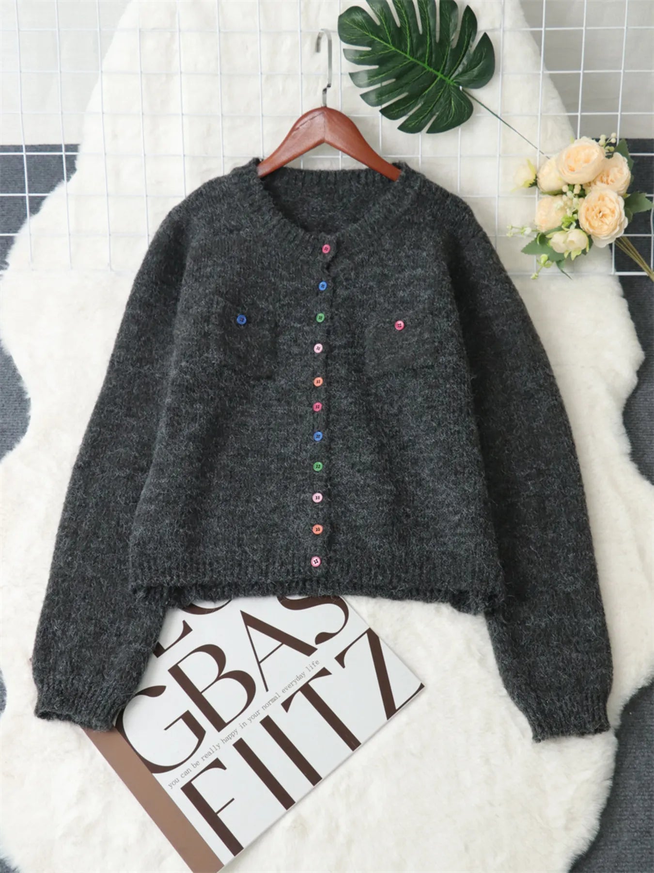 Dark gray button-up ribbed-hem cardigan with chest pockets and multicolor buttons