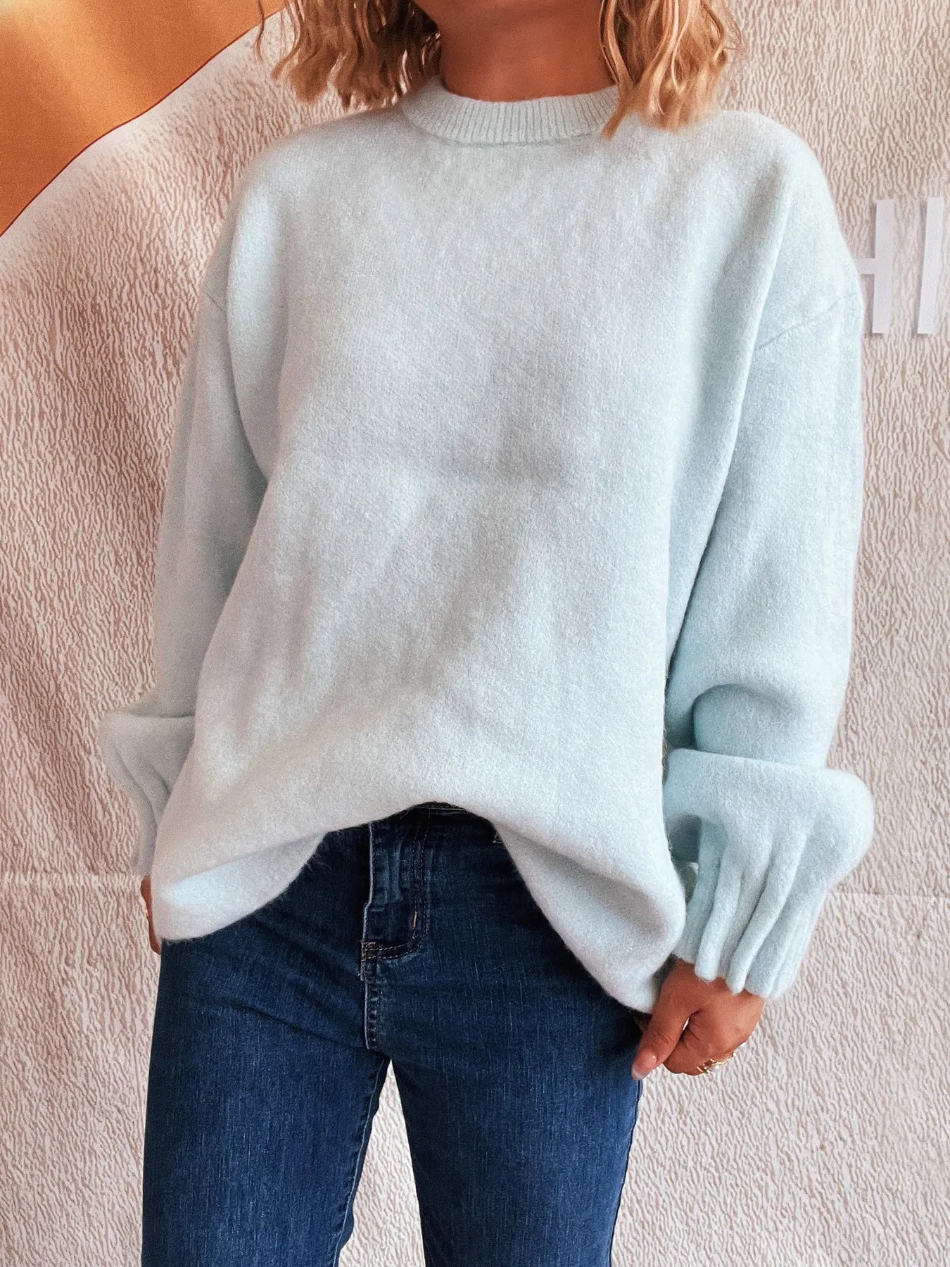 Light blue round neck dropped shoulder sweater with ribbed cuffs and hem