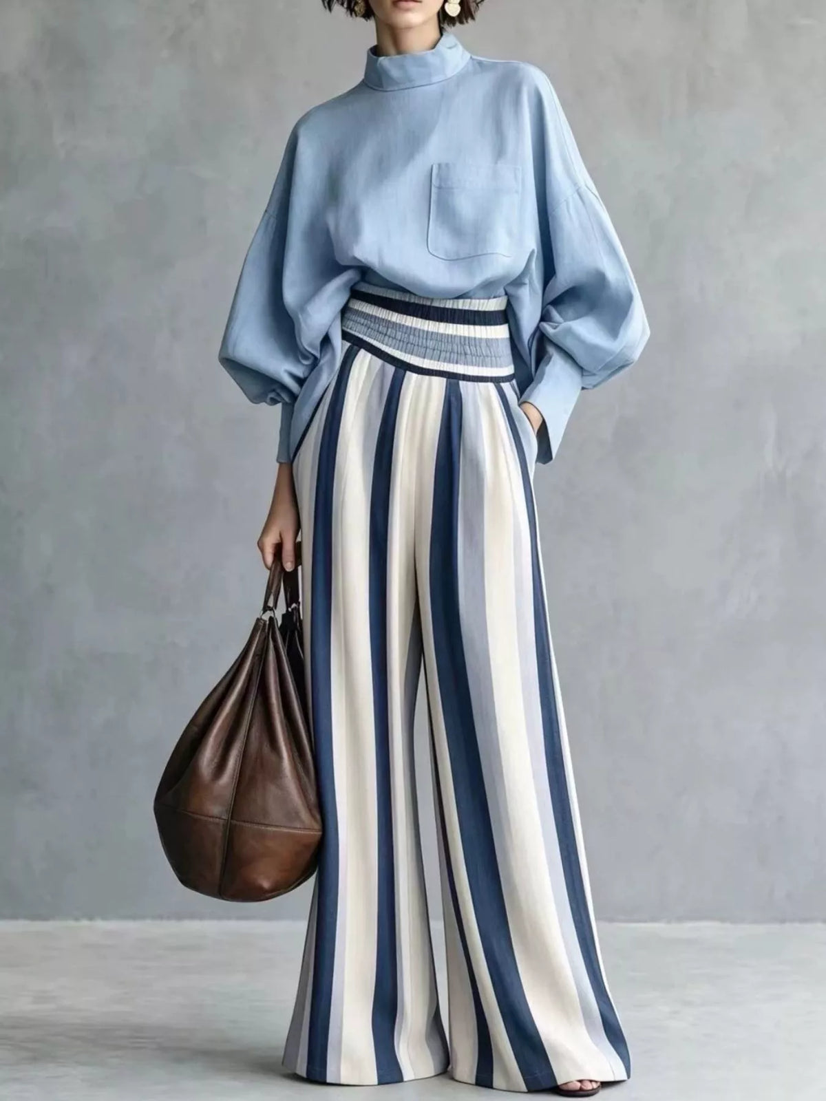 Two-piece striped mock neck blouse set with light blue top and cream-blue wide-leg pants