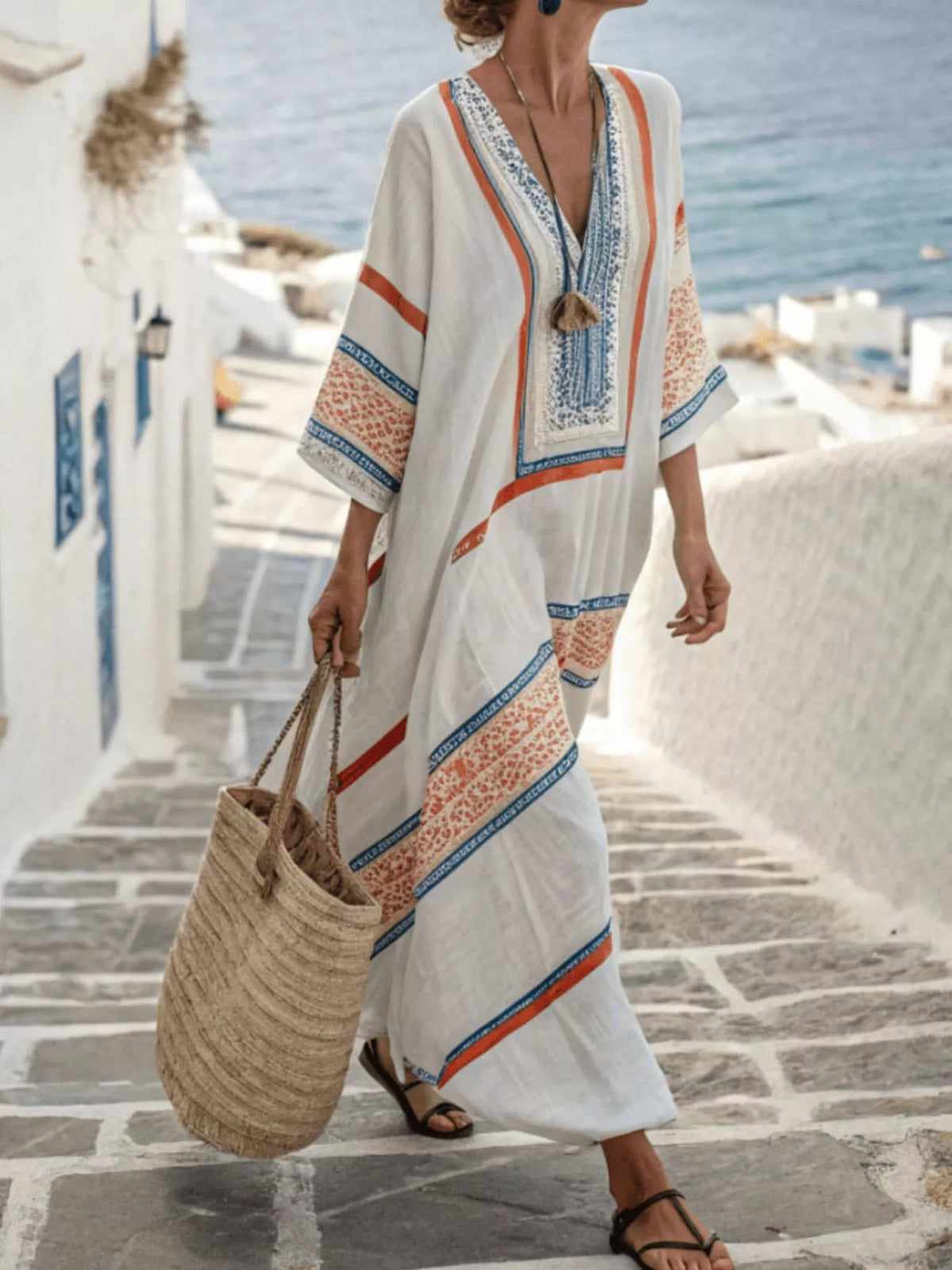 White V-neck maxi dress with multicolor border print, 3/4 sleeves and tassel tie