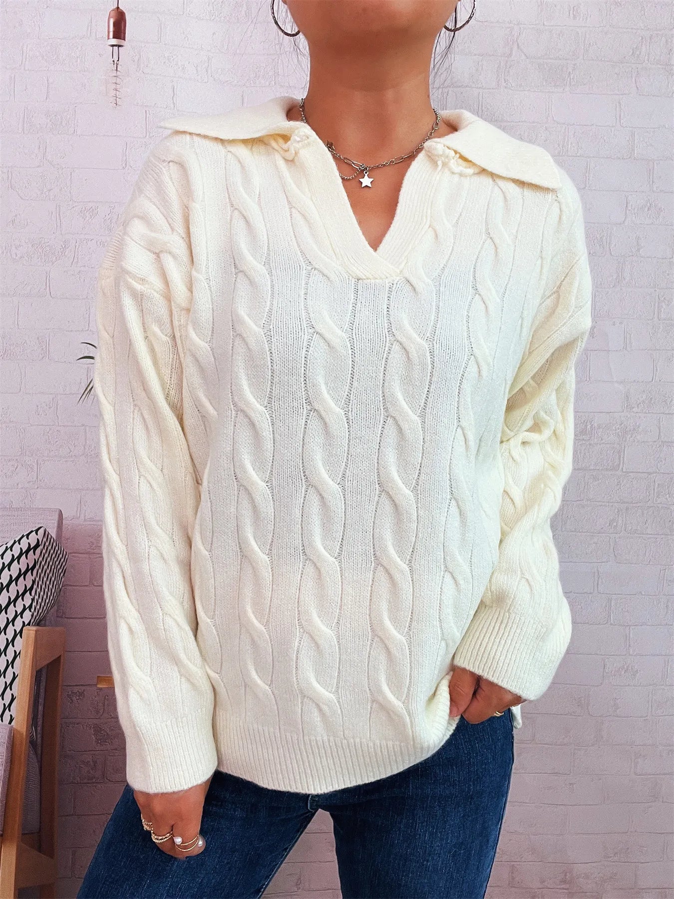 Cream cable knit Johnny-collar sweater with V-neck and raised cable pattern, long sleeves