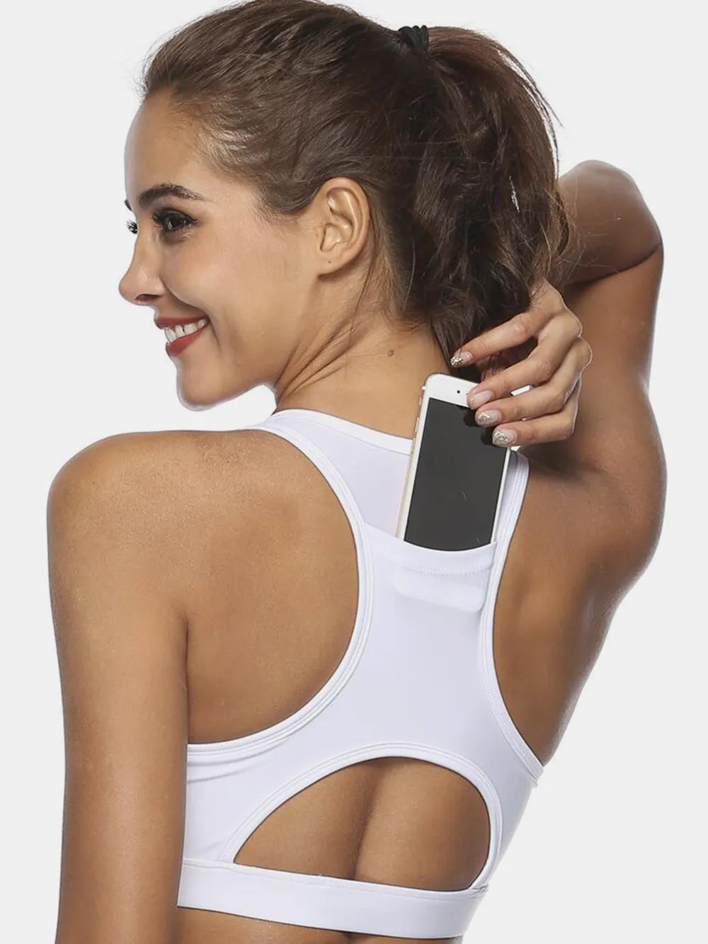 White active tank with scoop neck; cutout back and sporty hemline