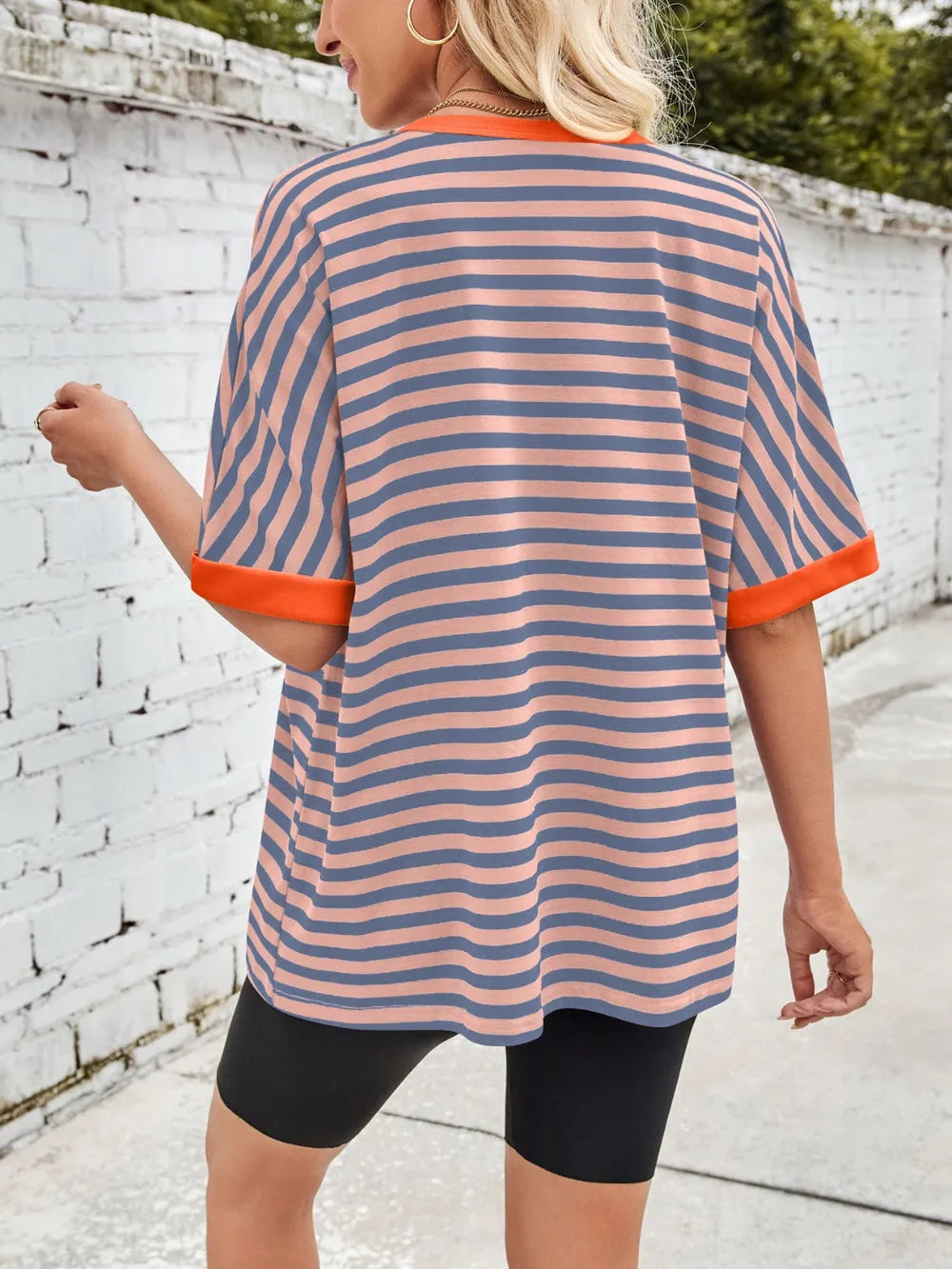 Striped round-neck half-sleeve T-shirt in blue with orange trim, back view