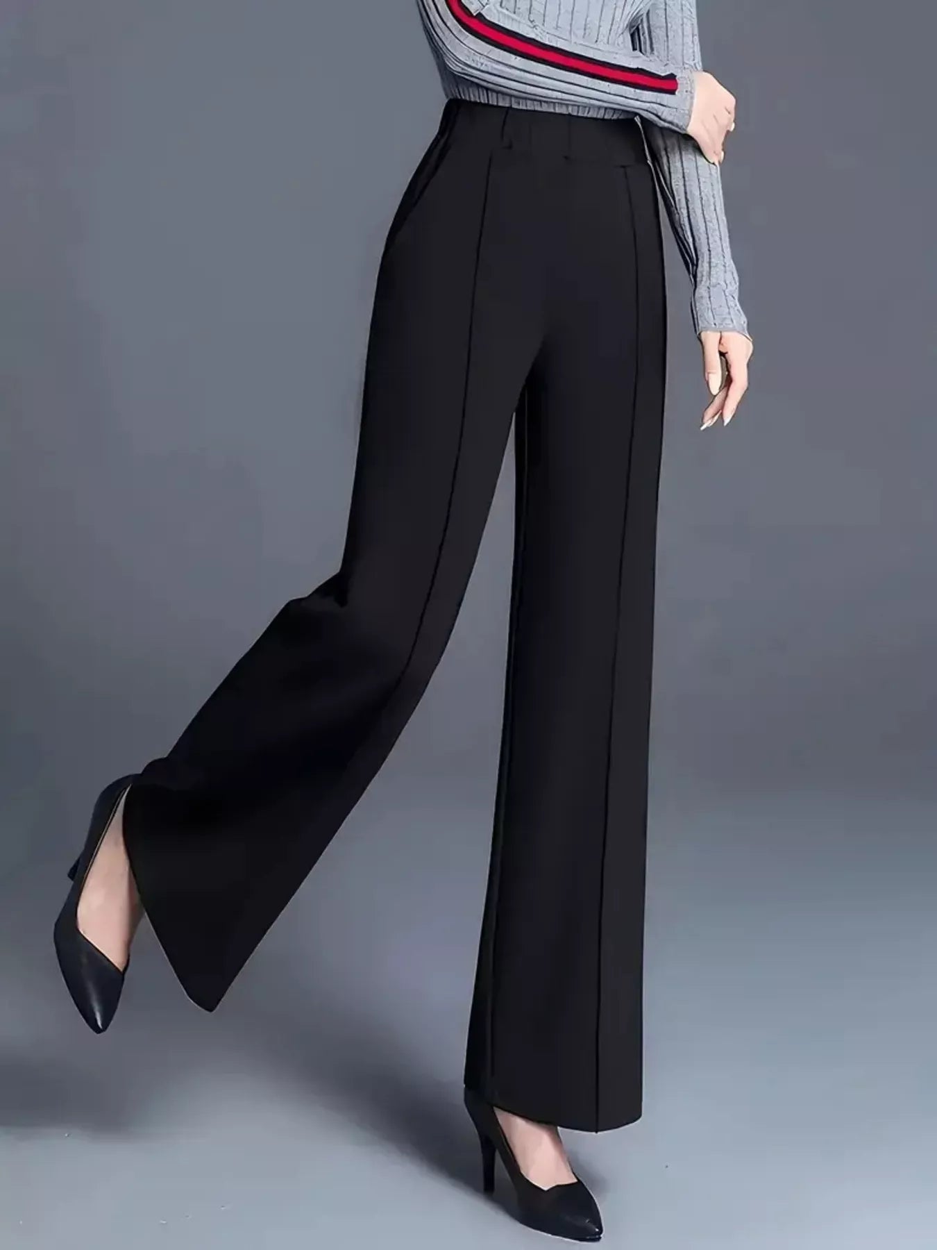 High-waisted wide-leg pants in black, draped wide legs with ankle-length hem and crease lines