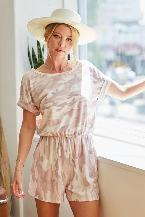 Pink camo print romper with short sleeves and elastic waist, side silhouette