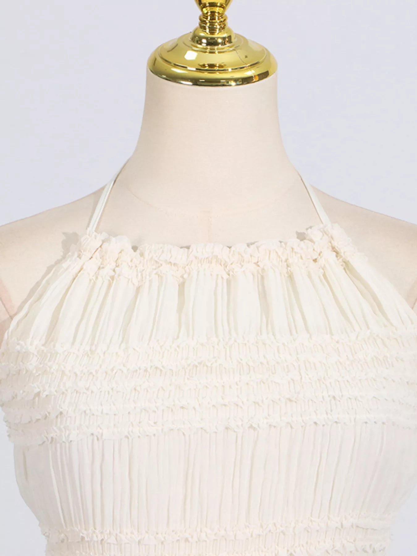 Cedar & Moore Ruched Halter Neck Maxi Dress by Trendsi in cream with smocked bodice and tied detail