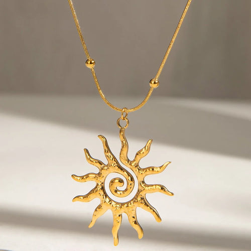 Gold-plated sun pendant necklace with large sun charm and rounded bead chain