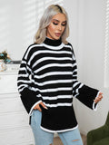 Black-and-white striped turtleneck sweater with drop shoulders and ribbed hem slit
