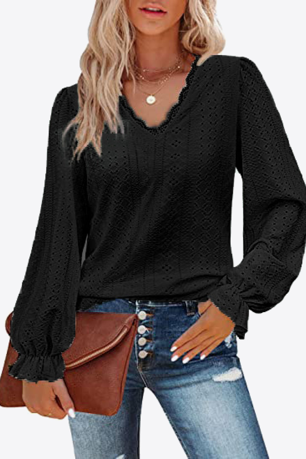 Black eyelet V-neck blouse with flounce cuffs and long puff sleeves