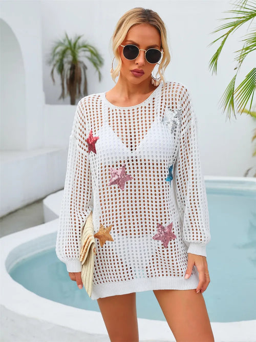 White long-sleeve cover-up sweater with sequin star cutouts and round neckline