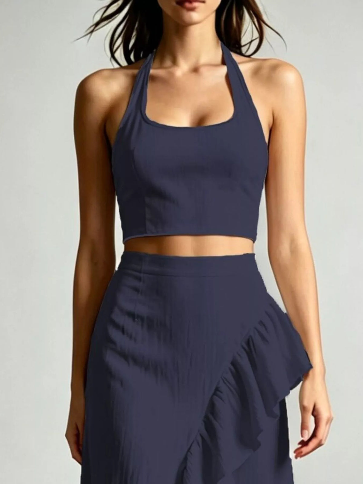 Navy halter crop top with ruffled high-low maxi skirt