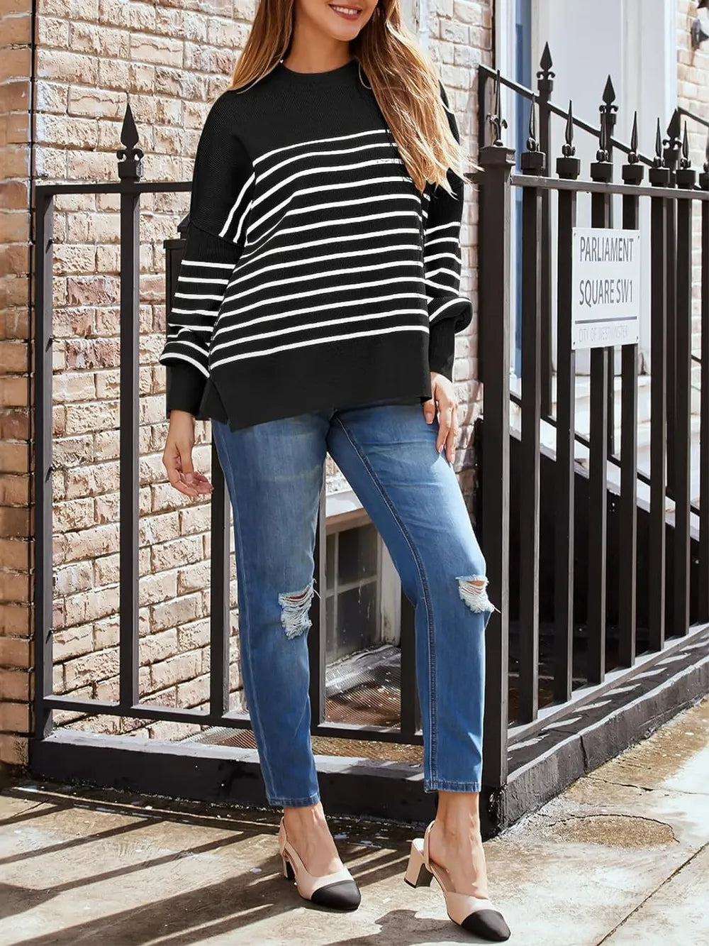 Back view black long-sleeve sweatshirt with round neck and white stripe front