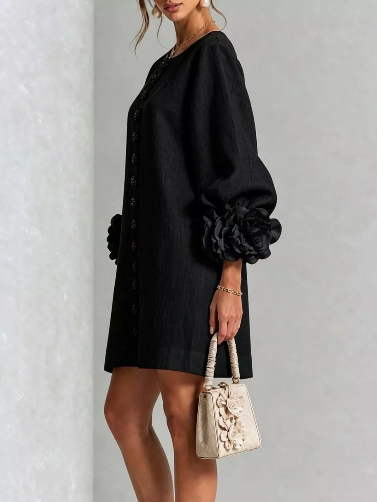 Black mini dress with 3D floral appliqué and quarter sleeves