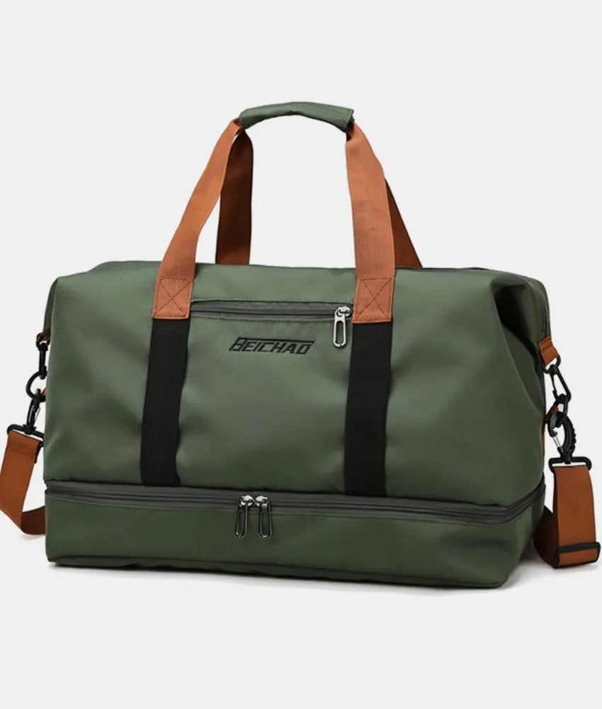 Olive green oversize travel duffle bag with black straps and front zipper pocket